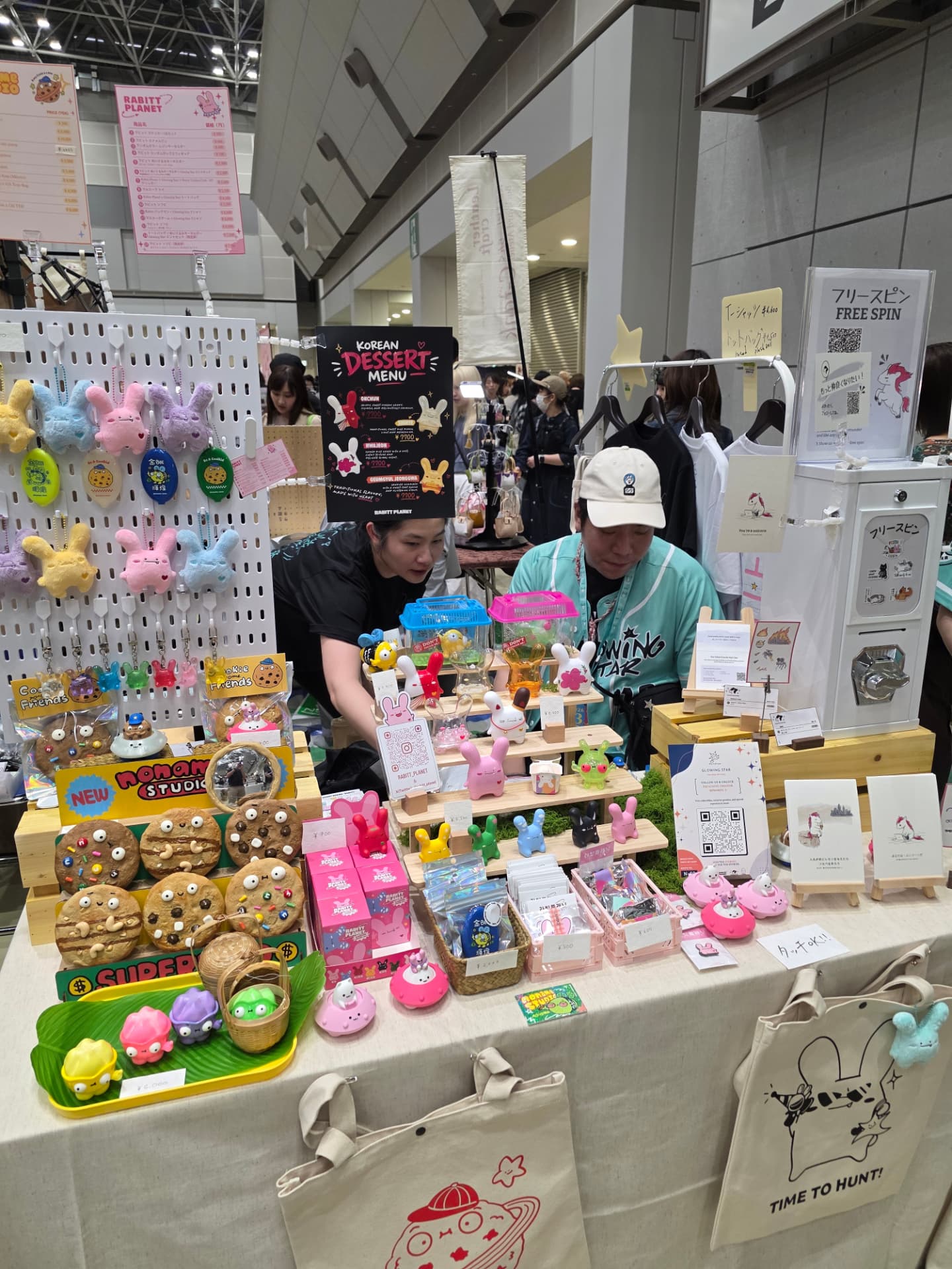 The Glowing Star booth at Design Festa Vol. 63: two attendants behind a table of Rabitt Planet and noname studio merchandise